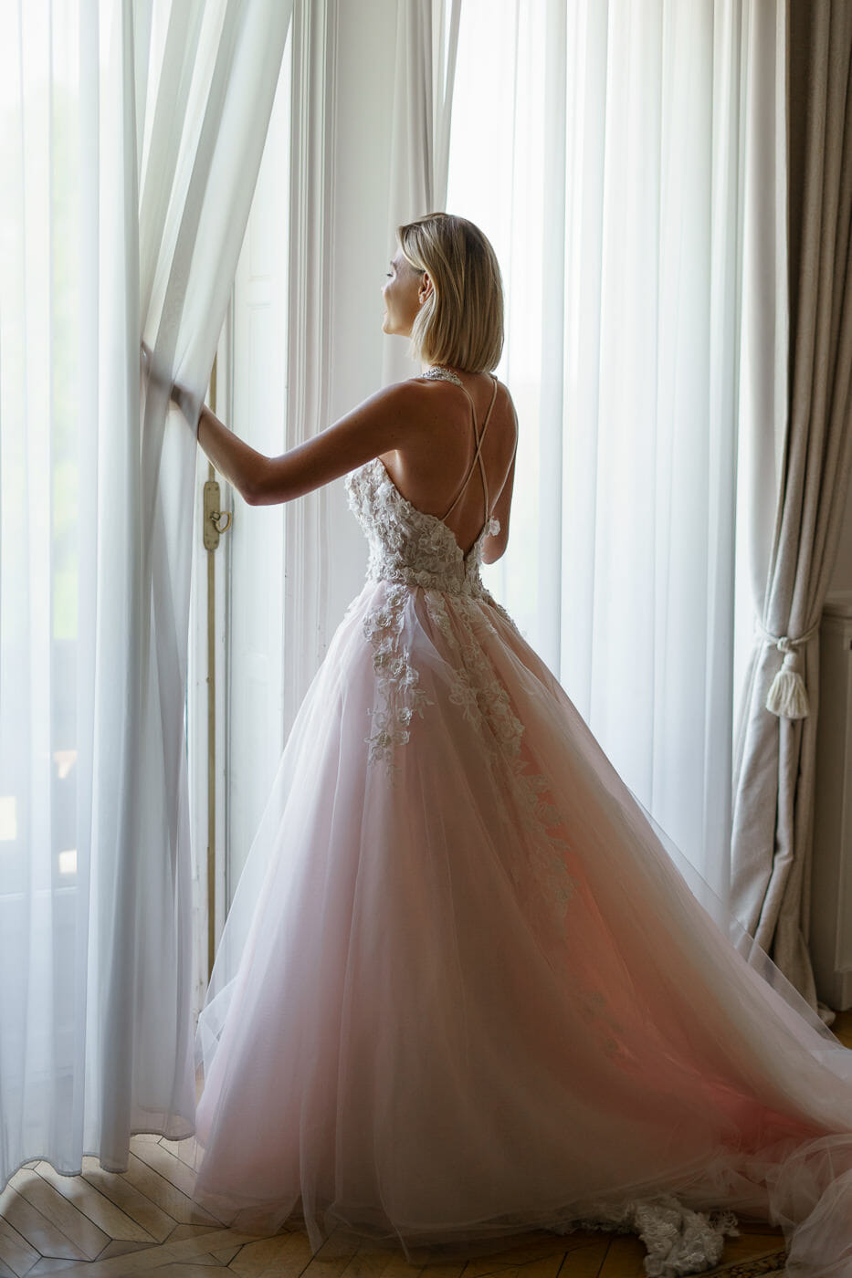 Bride looking into windows