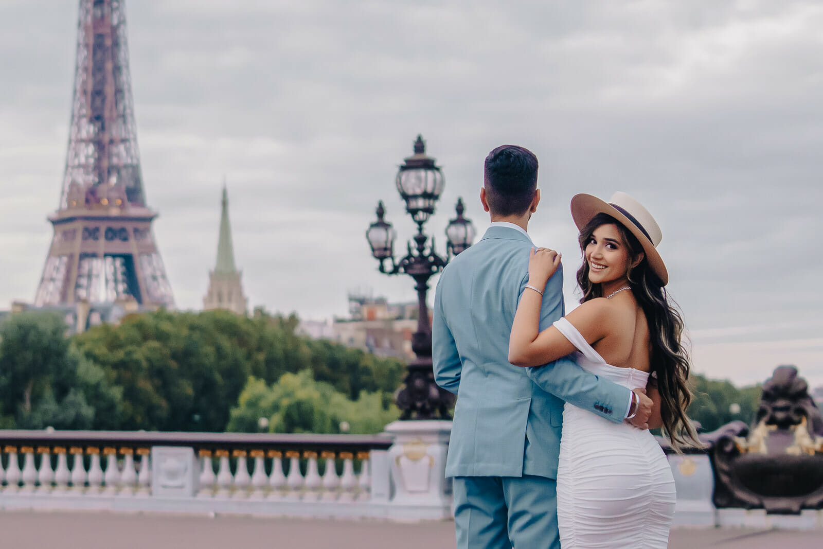 Couple photoshoot in Paris at Alexander III Bridge with Eiffel Tower view