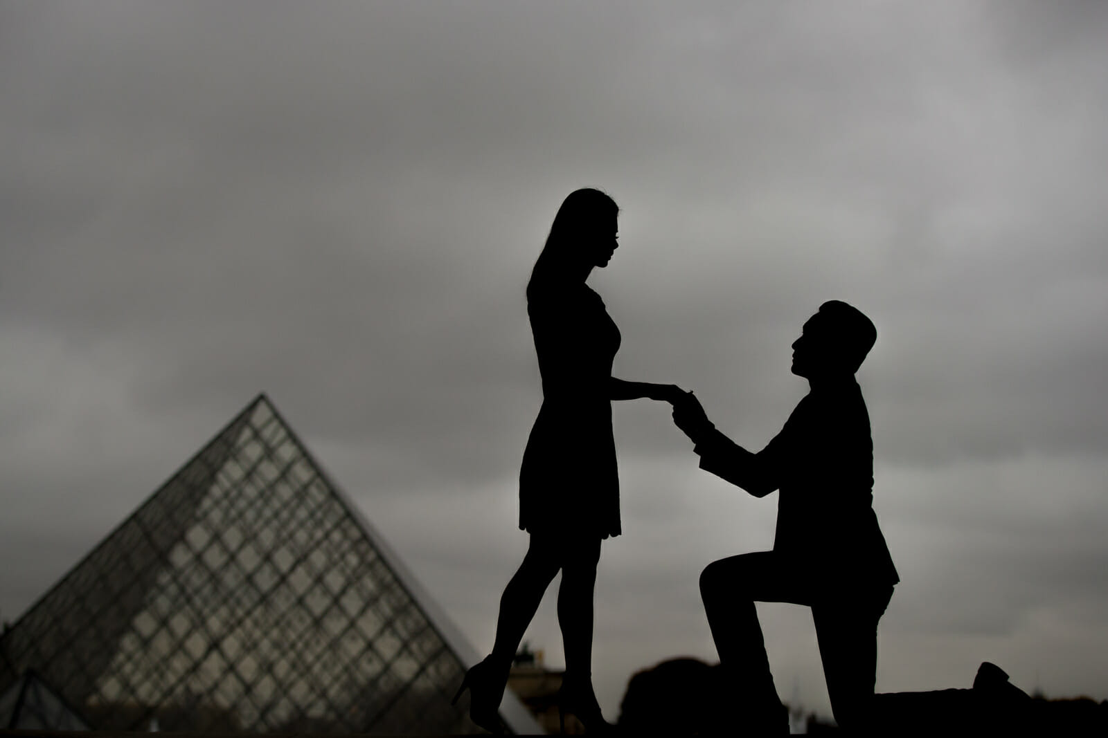 Unique engagement photos in Paris at the Louvre Museum in silhouette
