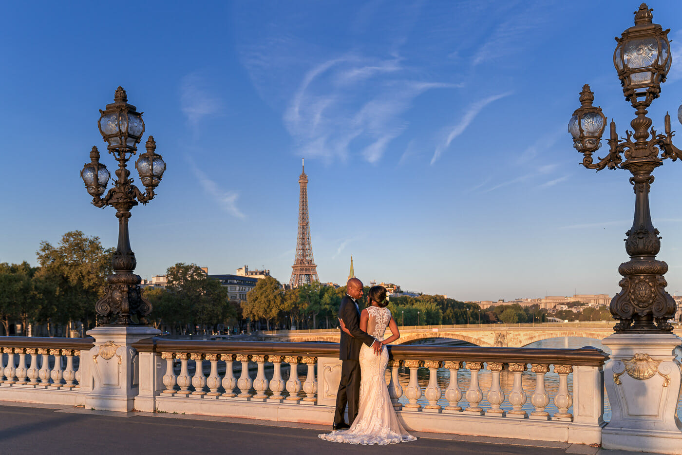 Stunning Paris wedding photo on the Alexander III Bridge at sunrise