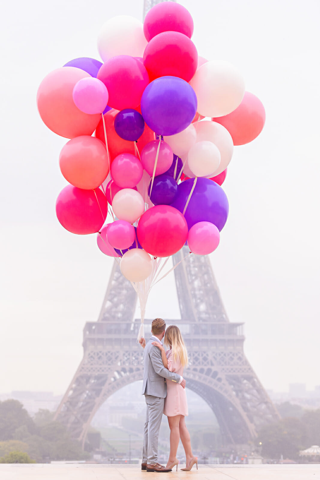 Cute engagement pics props Eiffel Tower Paris