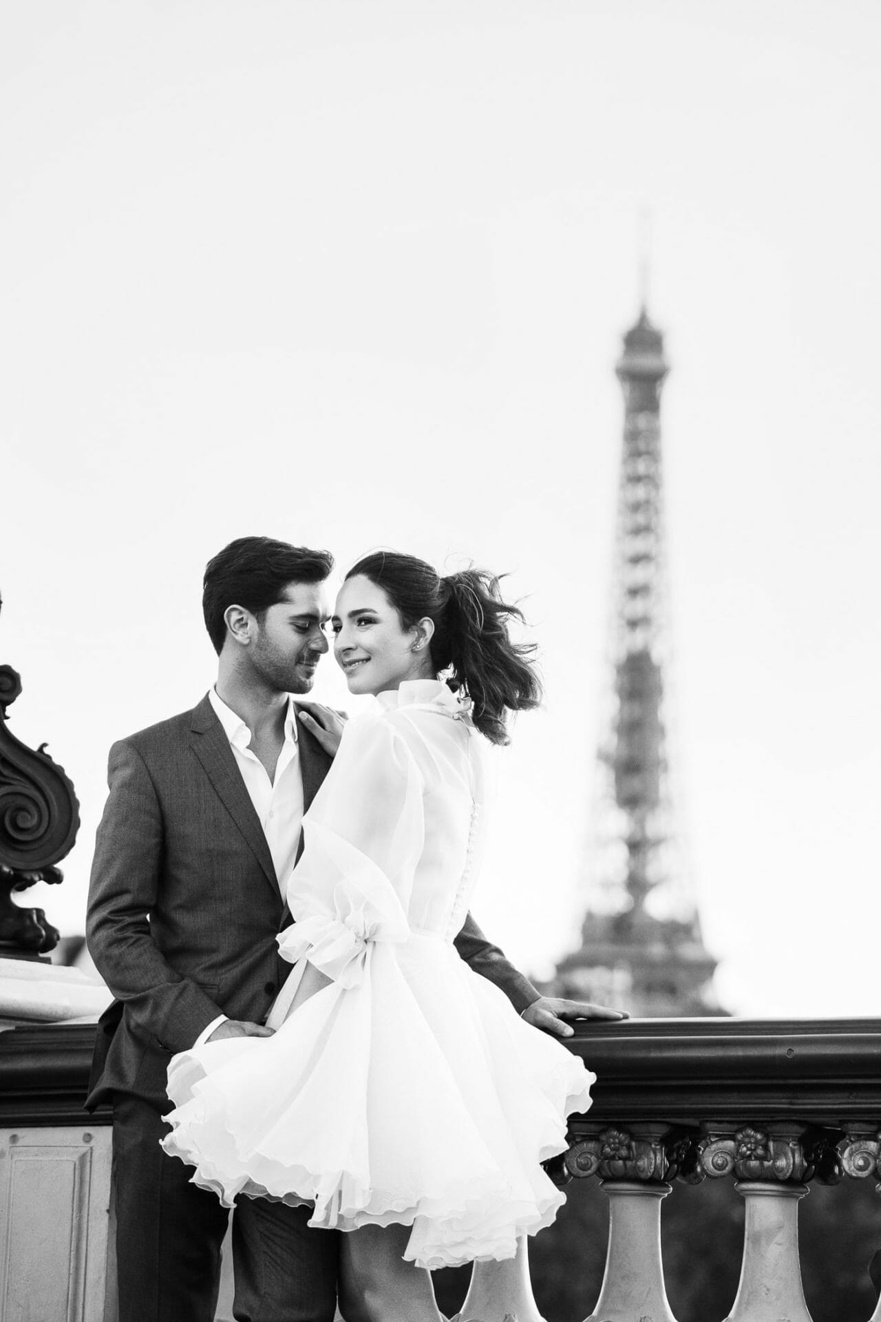 Romantic Eiffel Tower couple pictures at Alexander III Bridge