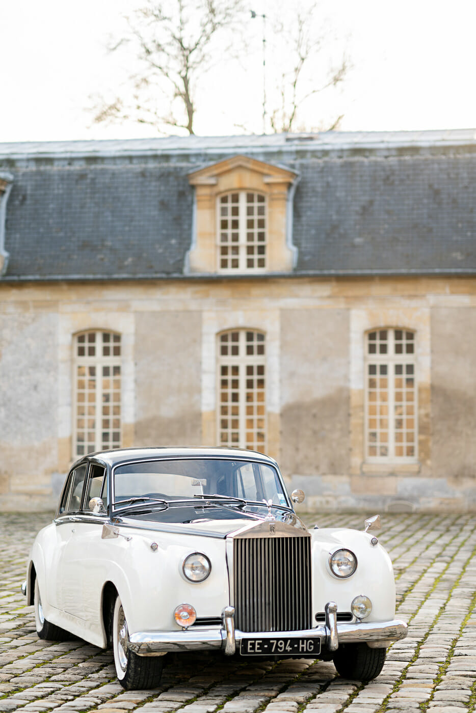 Vintage Rolls-Royce with driver at Chateau de Villette in Paris France
