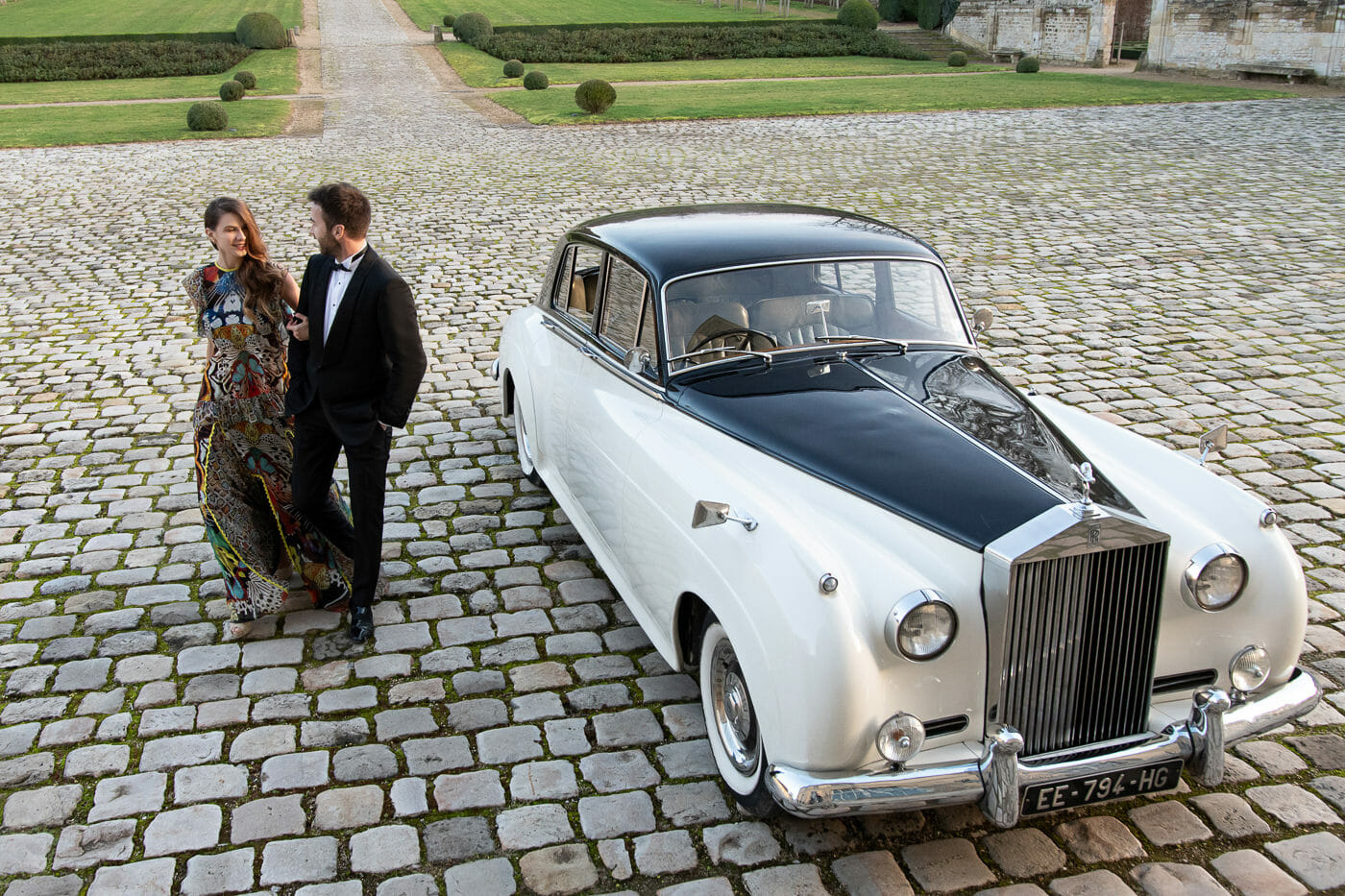 The couple arrives at Chateau de Villette with a vintage Rolls-Royce for their surprise Paris proposal