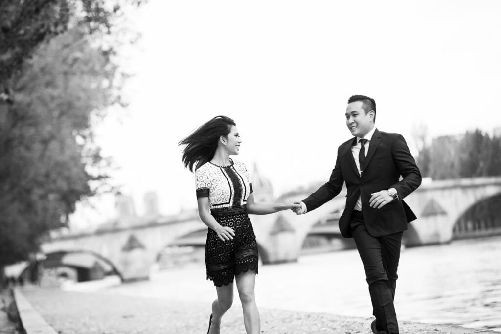 Natural looking couple photos in Paris along the Seine River near the Tuileries Gardens