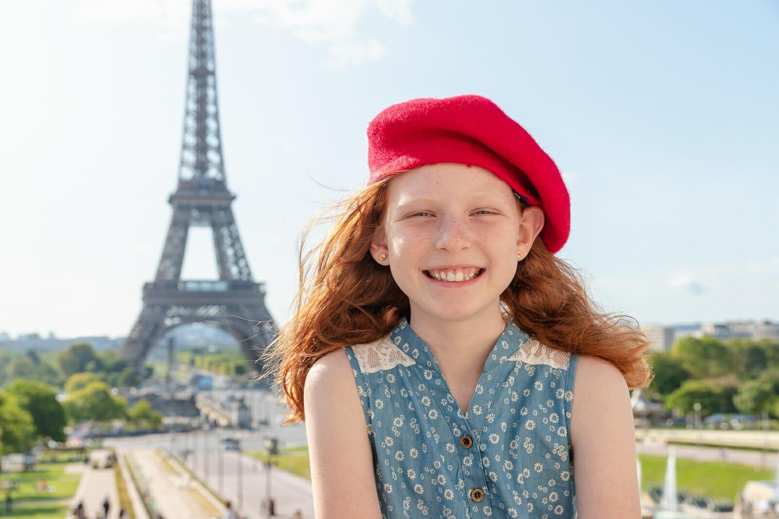 Stylish Paris family and kids portraits at Trocadero Eiffel Tower with red beret as prop