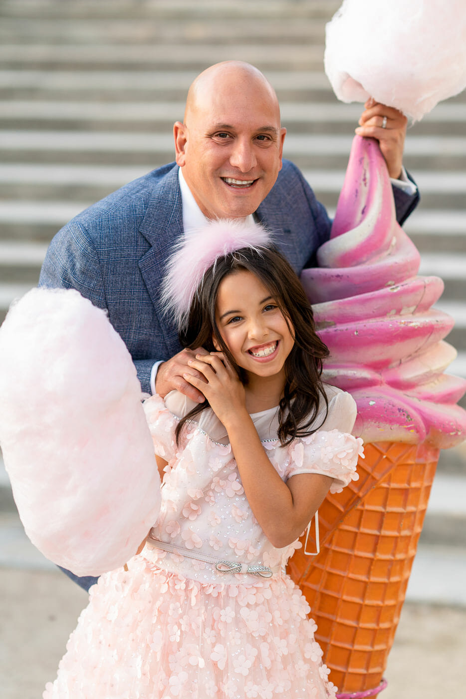 Cute Dad and Daughter Paris family portrait with massive pink cotton candy as prop