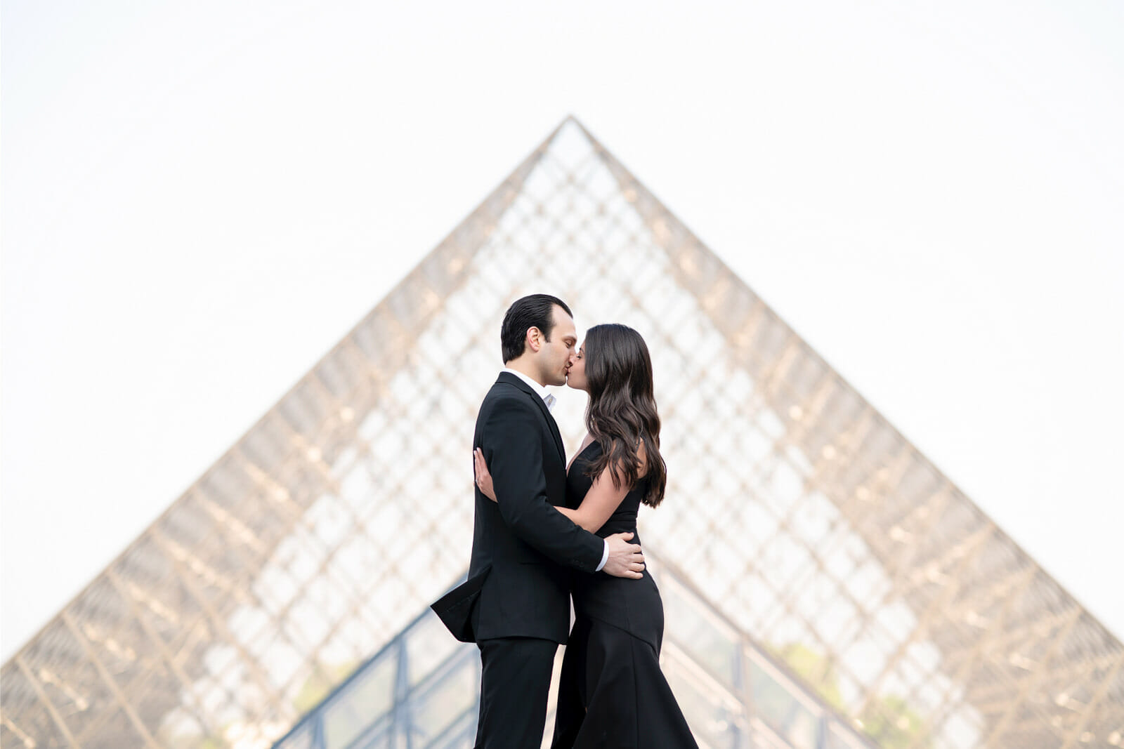 beautiful Paris couple photo shoot at the Louvre Museum in front of the pyramid