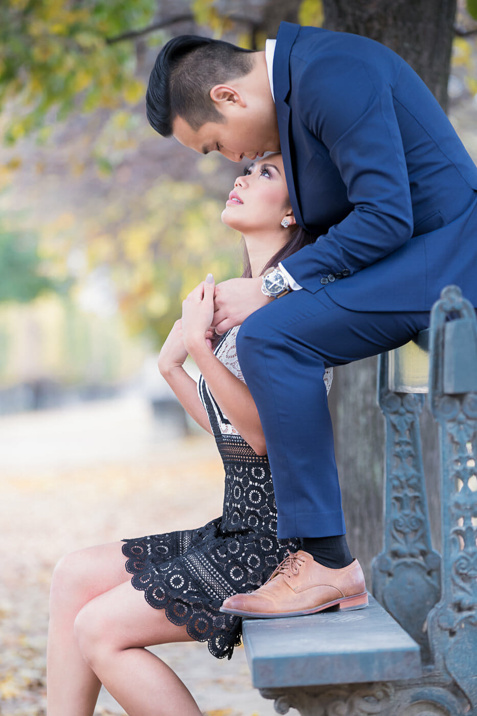 Intimate Paris engagement photos in the Tuileries Gardens on a bench