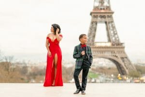 Paris family photos at the Eiffel Tower, one of the best photo spots in Paris, showcasing joyful moments with the iconic landmark in the background.