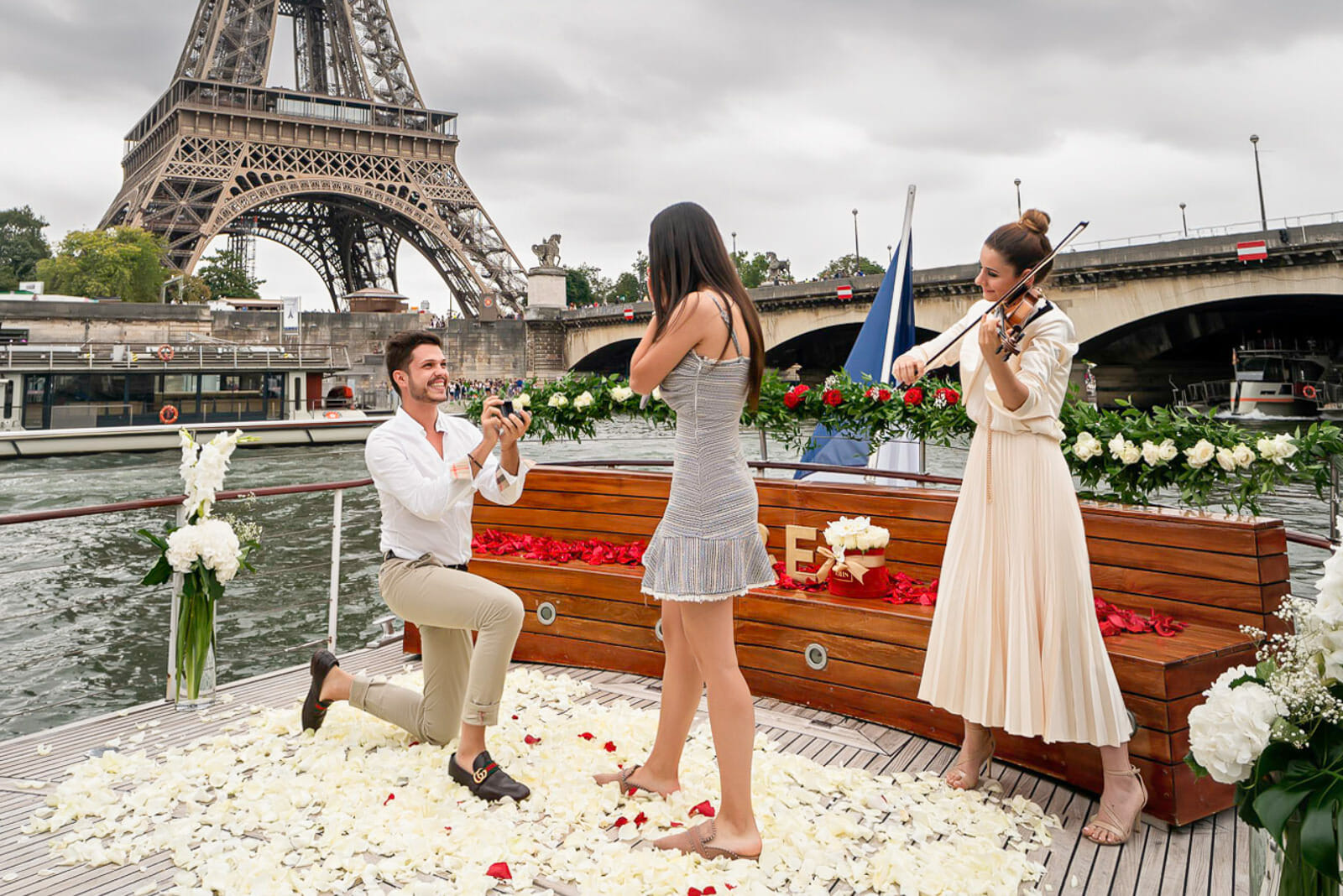 Luxury Paris boat proposal on the Seine with Eiffel Tower as the backdrop