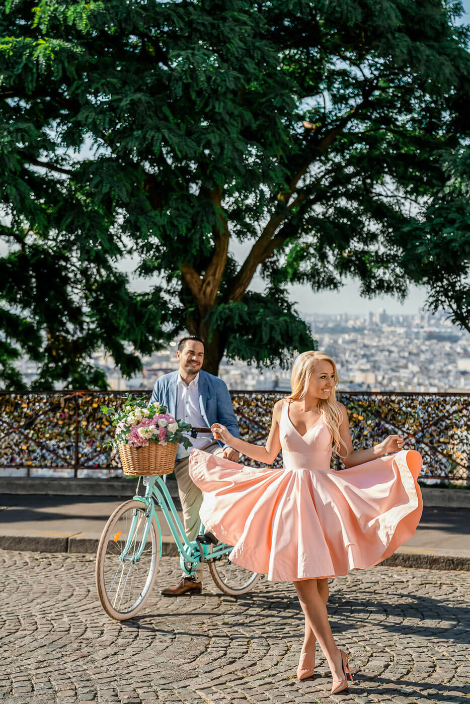 Fun couple photoshoot at Montmartre Paris with a rental bike and flowers