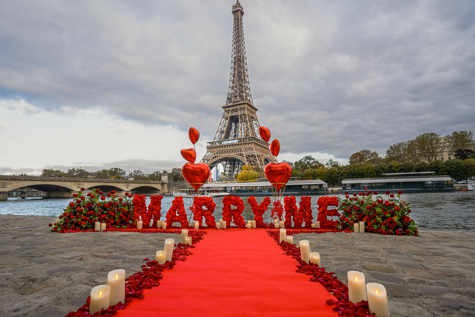 Marry Me Letters Paris proposal Seine River with a sumptuous red carpet.