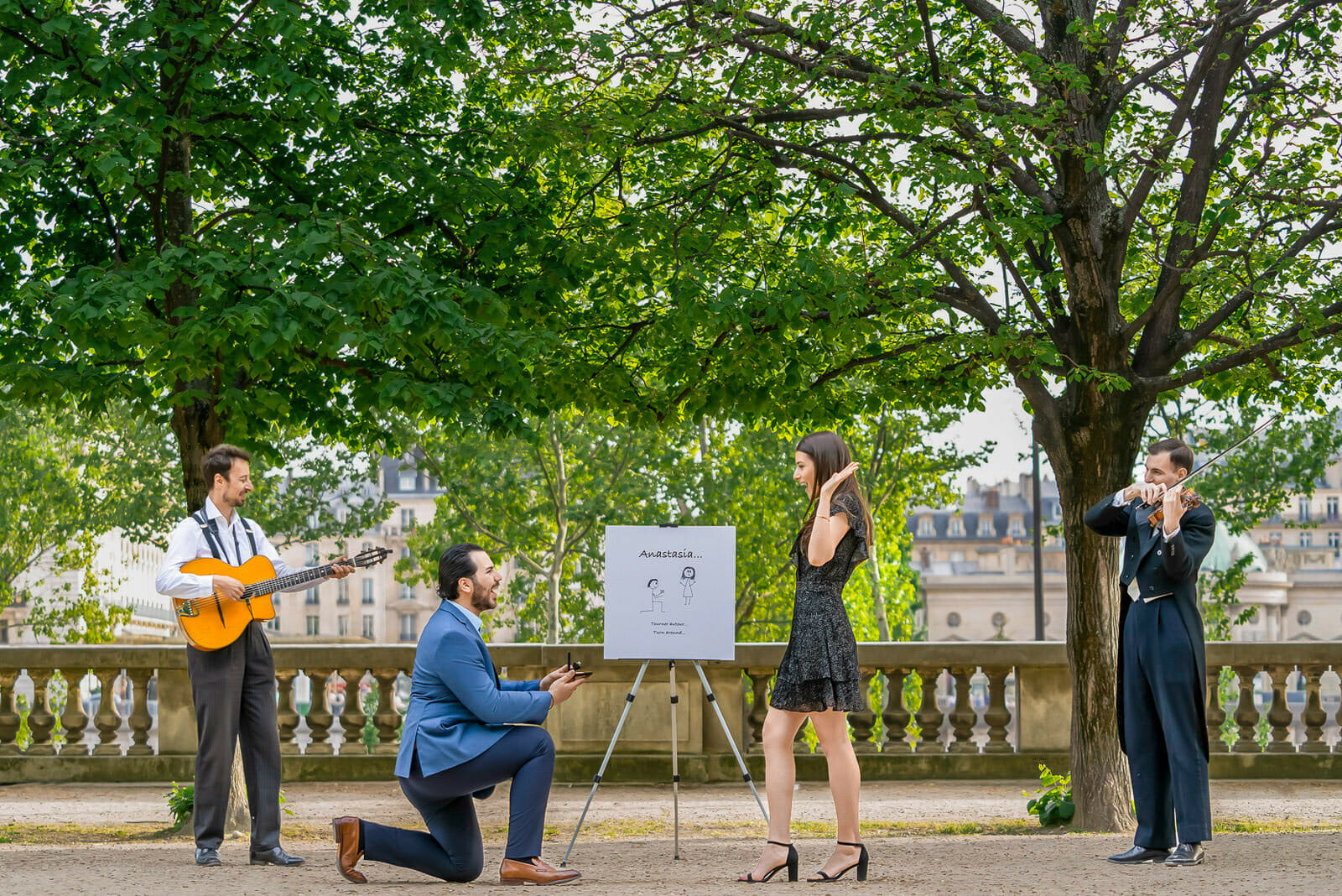 Cute Paris proposal ideas in the Tuileries Garden with musicians