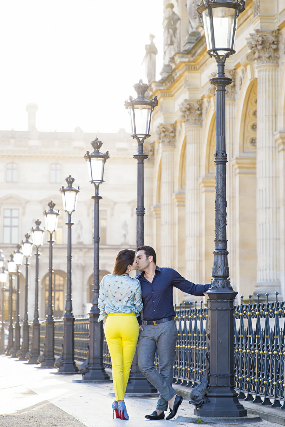 Sexy couple photoshoot pose at the Louvre Museum around sunrise