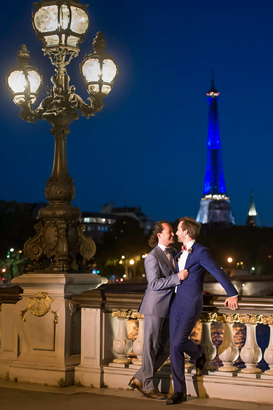 Stylish same sex Paris engagement photos on Alexander III Bridge