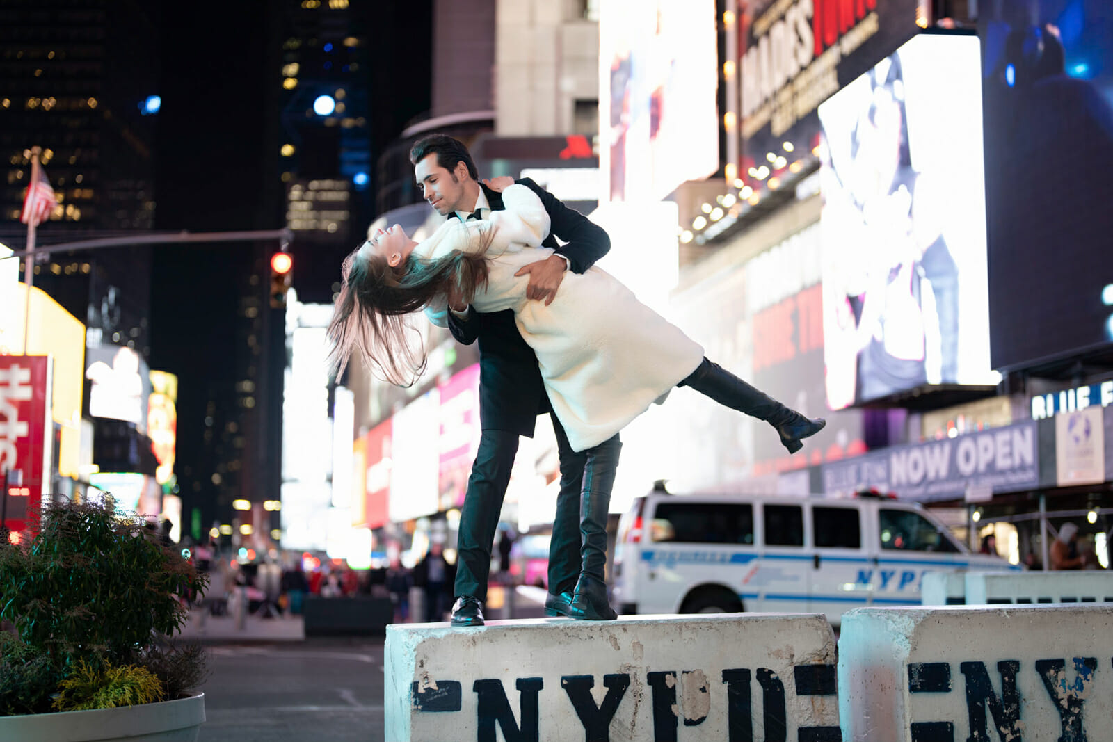 Times Square engagement Photos Couple doing the sailor kiss