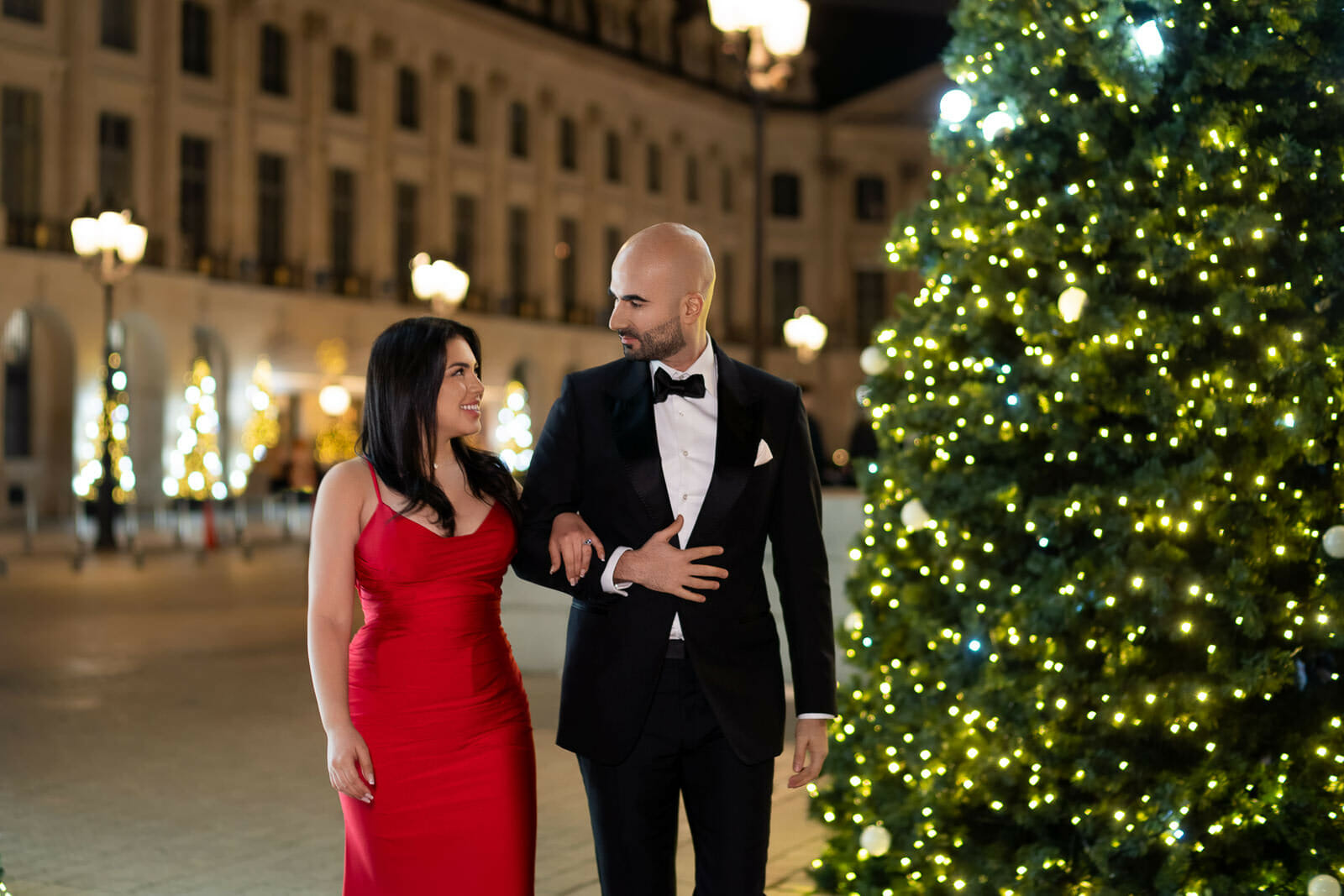 Paris engagement photos at Place Vendôme Paris with Christmas trees lit up