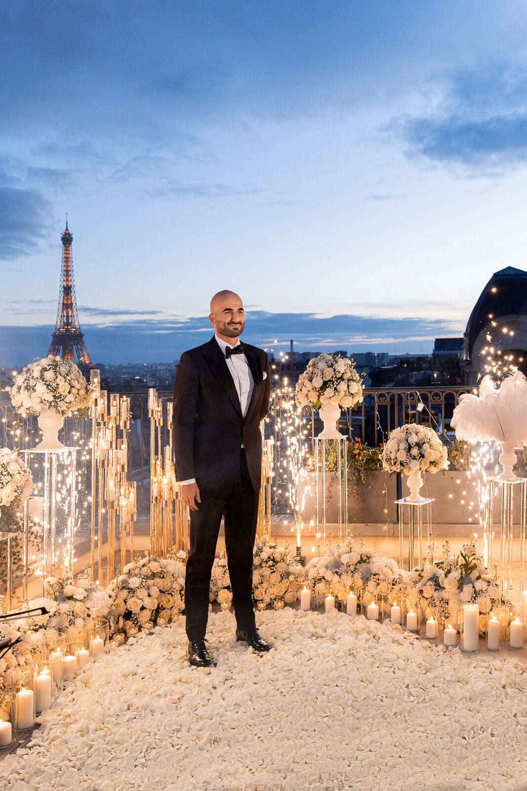 Epic Eiffel Tower Proposal with candles and white roses