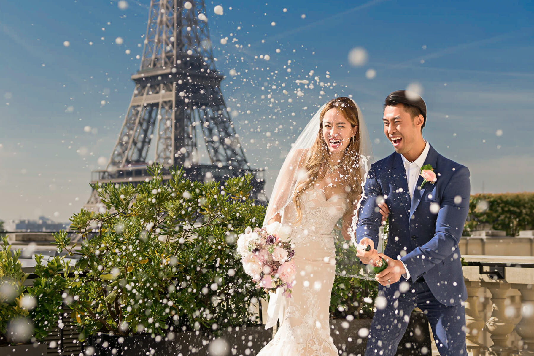 Paris elopement at the Shangri-La Hotel: fun couple popping Champagne as newlyweds