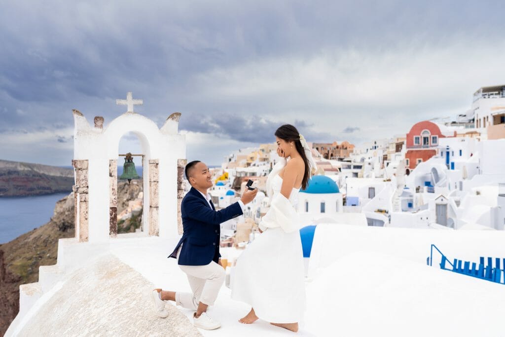 marriage proposal in Santorini on a famous church