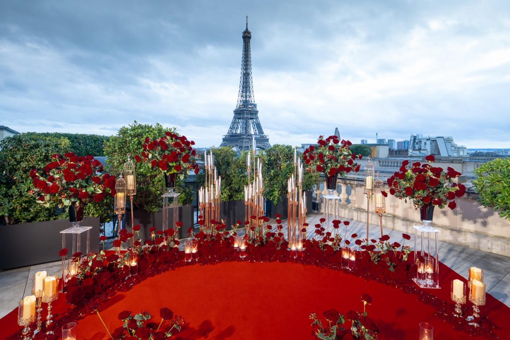Romantic winter proposal in Paris. Elegant dinner in Shangri-La suite with Eiffel Tower view, awaiting private butler.