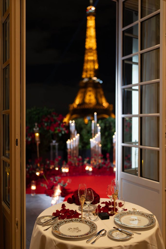 Romantic winter proposal in Paris. Elegant dinner in Shangri-La suite with Eiffel Tower view, awaiting private butler.