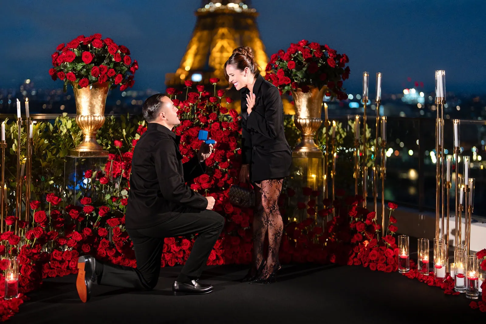 Paris proposal planner creates luxury engagement at Shangri-La Hotel with Eiffel Tower view, roses, candles, and emotional couple